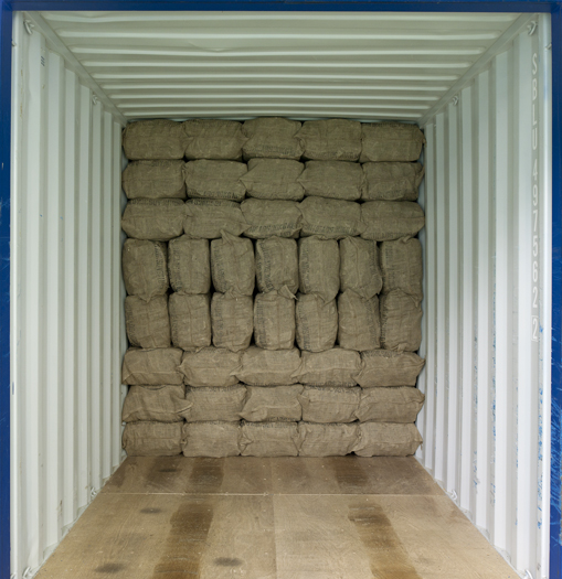 Hessian bags of dried fish loaded in a container